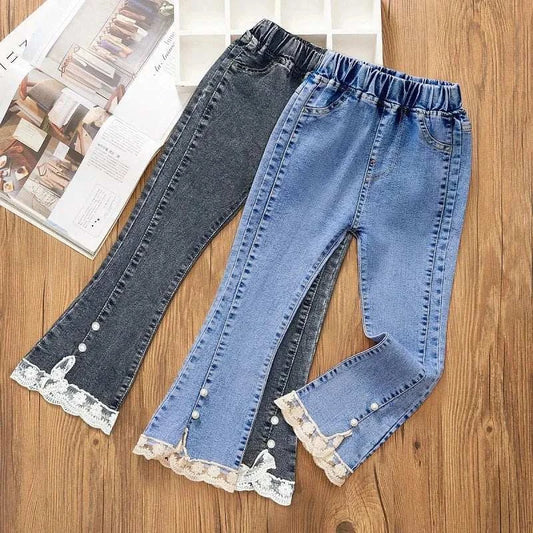 Girls' jeans for girls aged 3-12 with loose flare design, lace and pearl decoration, elastic waist, available in blue and black denim.