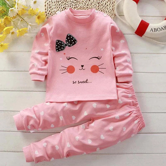 Pink autumn sleepwear pajamas for kids with long sleeves and heart pattern pants, featuring a cute cartoon cat face and bow design