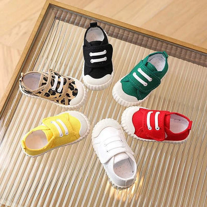 Colorful childrens canvas shoes for toddlers with non-slip rubber soles and hook & loop closures, suitable for boys and girls.