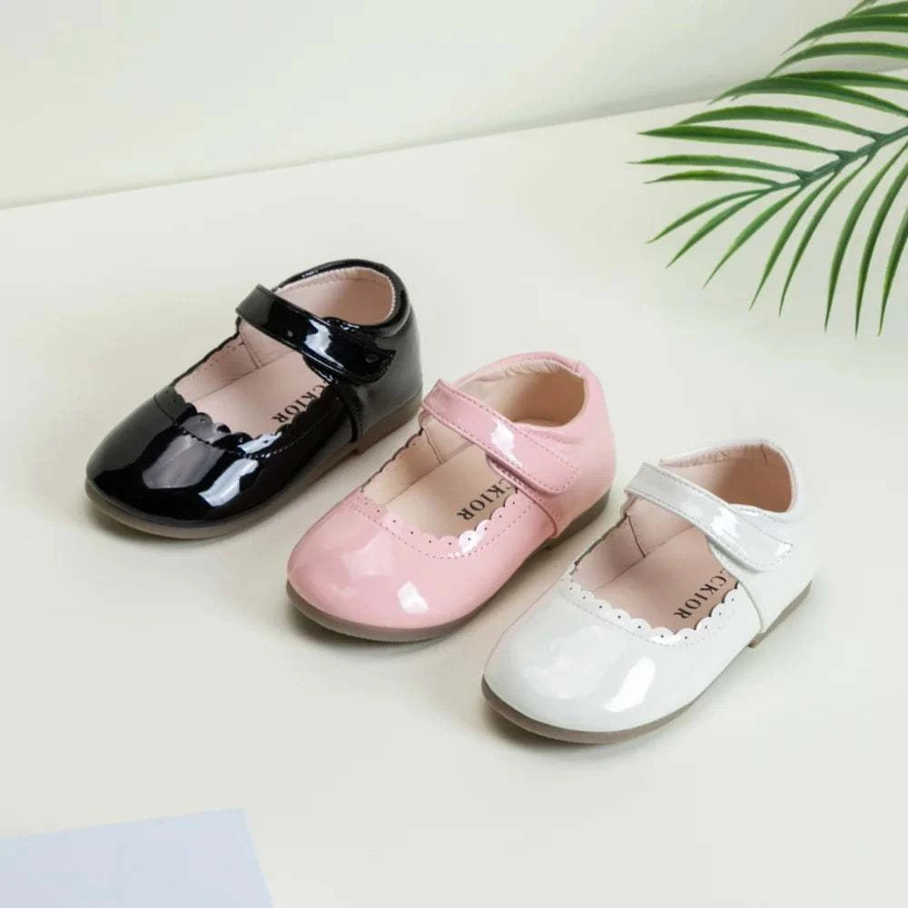 Girls soft bottom multi-color leather breathable princess shoes for baby girls in black, pink, and white colors.