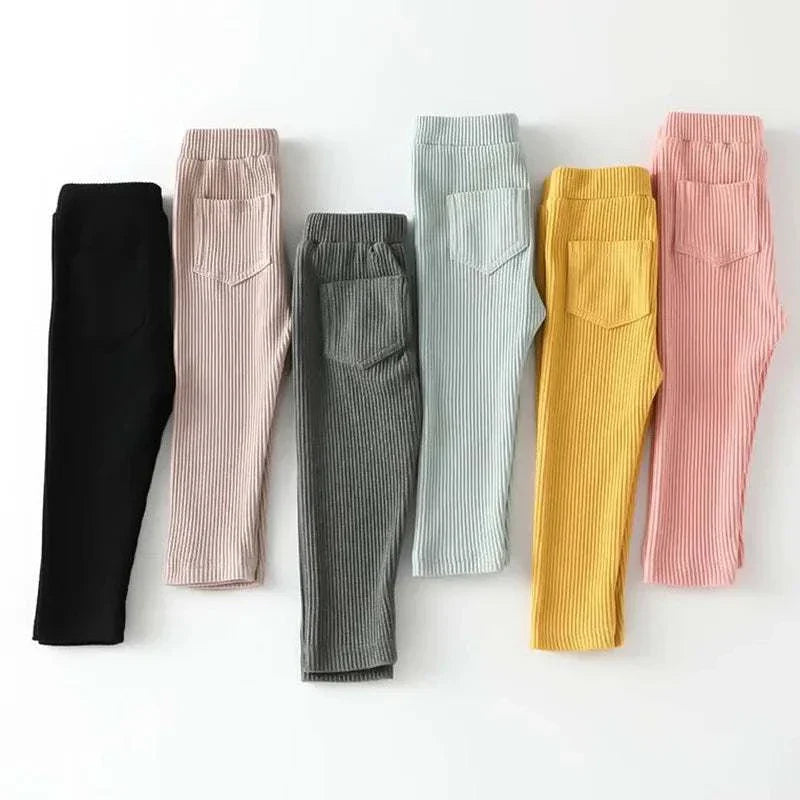 Set of children's cotton ribbed leggings in solid colors including black, pink, gray, light blue, yellow, and peach, suitable for girls and boys in spring and autumn with high waist design.